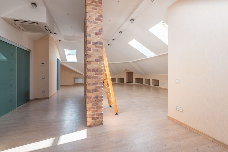 Professional installing spray foam and attic insulation