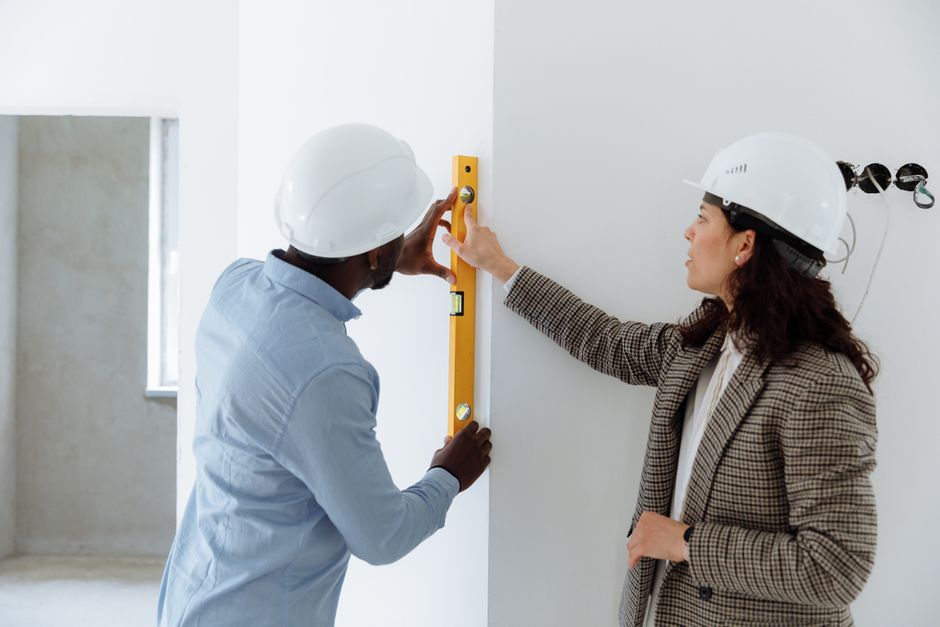 Contractor using tools to prepare exterior siding materials
